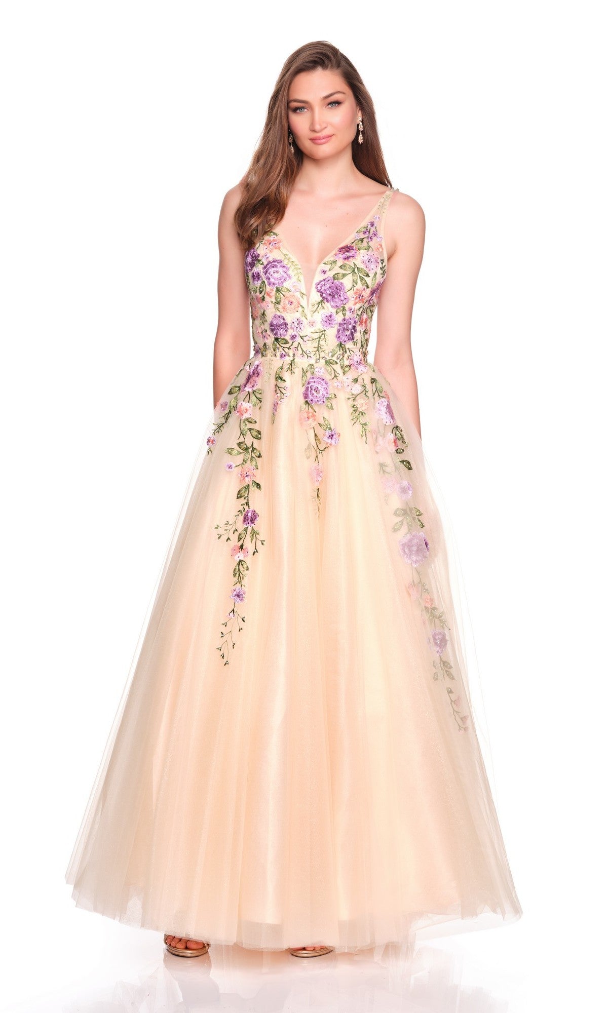 A woman models the Dave and Johnny 12479 long prom dress, showcasing a sleeveless fitted bodice with purple floral embroidery and a flowing tulle skirt, posed against a white background.